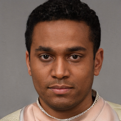 Neutral black young-adult male with short  black hair and brown eyes
