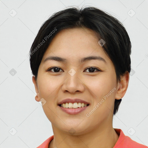 Joyful asian young-adult female with short  brown hair and brown eyes