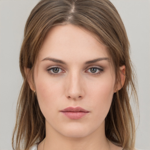 Neutral white young-adult female with long  brown hair and brown eyes