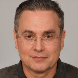 Joyful white middle-aged male with short  brown hair and brown eyes
