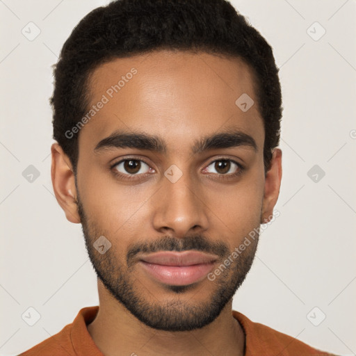 Joyful black young-adult male with short  brown hair and brown eyes