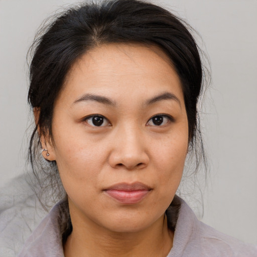 Neutral asian young-adult female with medium  brown hair and brown eyes