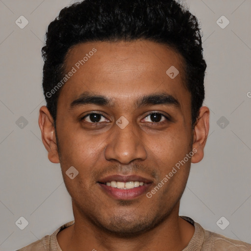 Joyful latino young-adult male with short  black hair and brown eyes