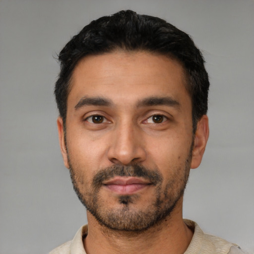 Neutral latino young-adult male with short  black hair and brown eyes
