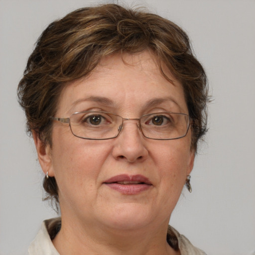 Joyful white middle-aged female with medium  brown hair and grey eyes