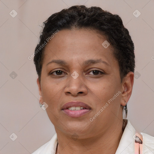 Joyful latino adult female with short  brown hair and brown eyes