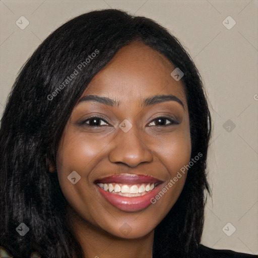 Joyful black young-adult female with long  black hair and brown eyes