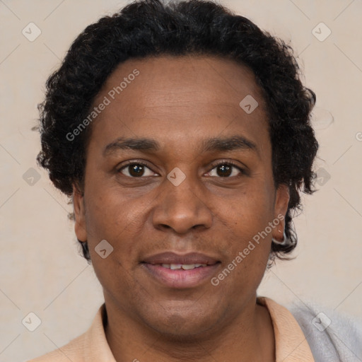 Joyful black adult male with short  brown hair and brown eyes
