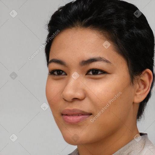 Joyful asian young-adult female with short  black hair and brown eyes