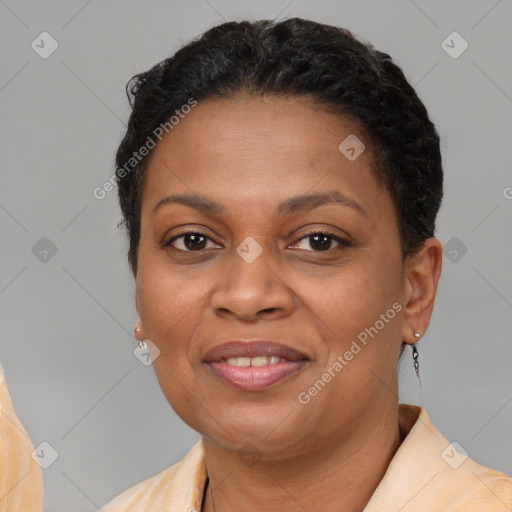 Joyful latino adult female with short  brown hair and brown eyes