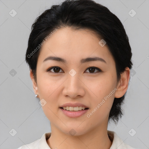 Joyful asian young-adult female with medium  black hair and brown eyes