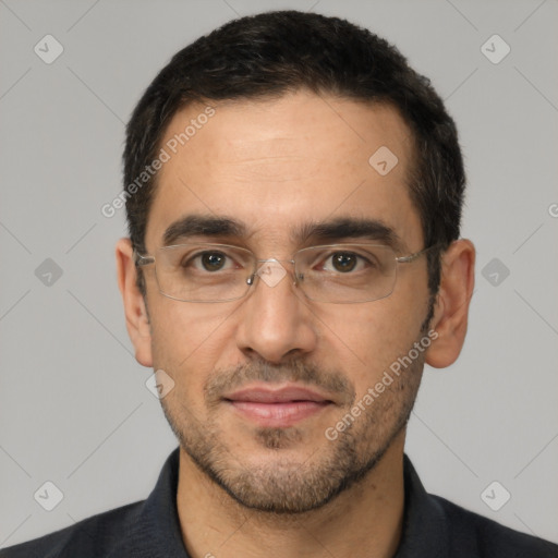 Joyful white adult male with short  black hair and brown eyes