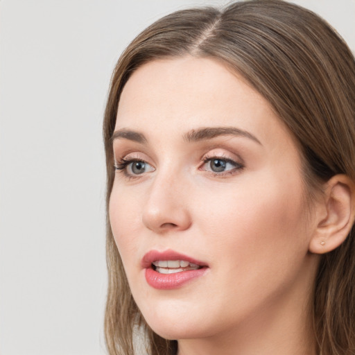 Neutral white young-adult female with long  brown hair and grey eyes