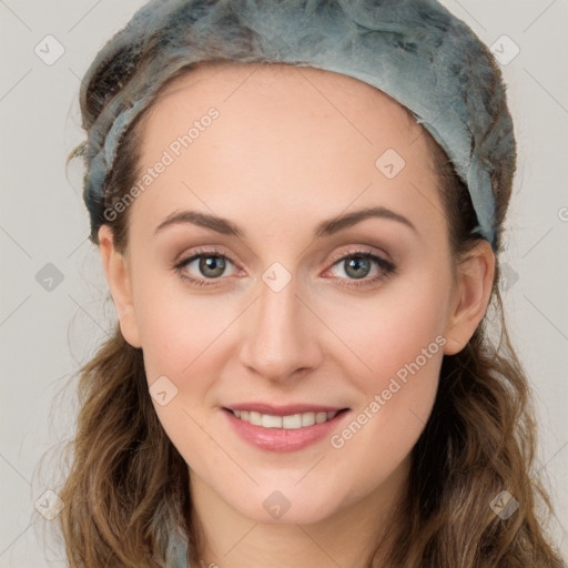 Joyful white young-adult female with long  brown hair and green eyes