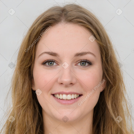 Joyful white young-adult female with long  brown hair and green eyes