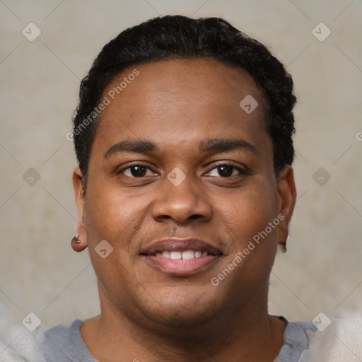 Joyful black young-adult male with short  black hair and brown eyes