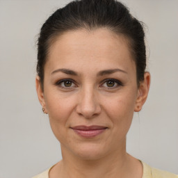 Joyful white adult female with short  brown hair and brown eyes