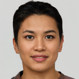 Joyful asian young-adult female with short  brown hair and brown eyes