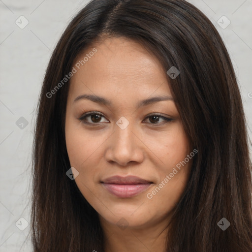 Joyful latino young-adult female with long  brown hair and brown eyes