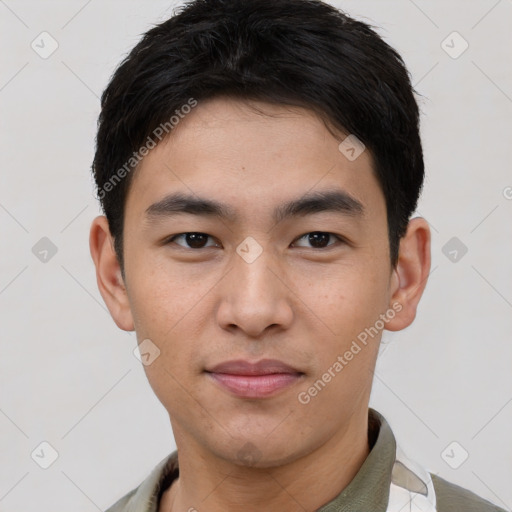 Joyful asian young-adult male with short  brown hair and brown eyes