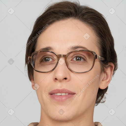 Joyful white adult female with medium  brown hair and grey eyes