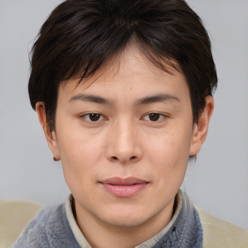 Joyful asian young-adult female with short  brown hair and brown eyes