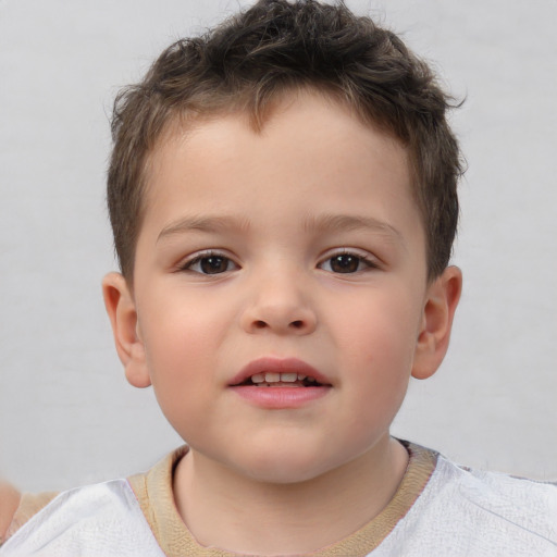 Joyful white child male with short  brown hair and brown eyes