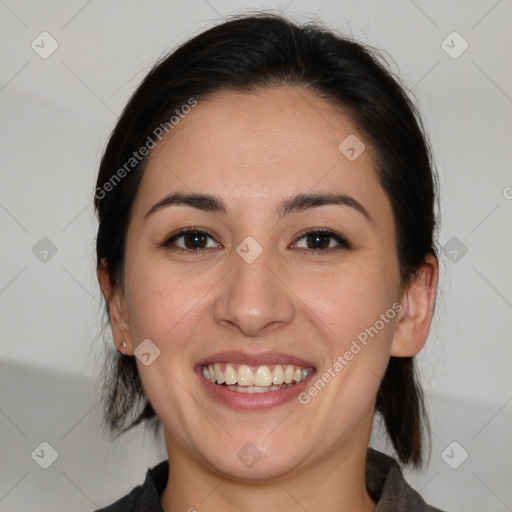 Joyful white young-adult female with medium  black hair and brown eyes