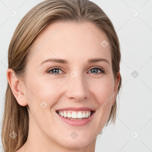 Joyful white young-adult female with medium  brown hair and blue eyes