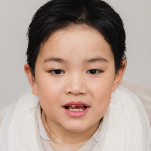 Joyful asian child female with medium  brown hair and brown eyes