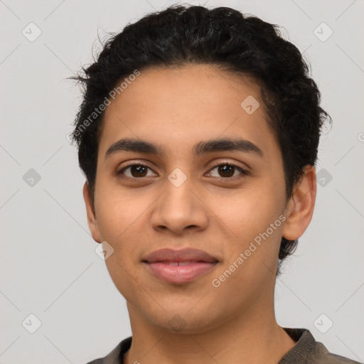 Joyful latino young-adult male with short  black hair and brown eyes