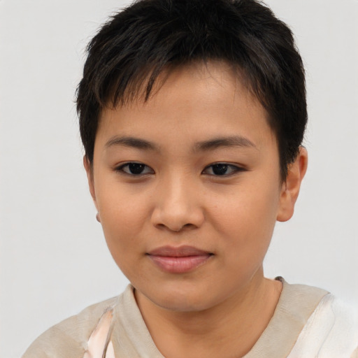 Joyful asian child female with short  brown hair and brown eyes