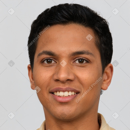 Joyful latino young-adult male with short  brown hair and brown eyes