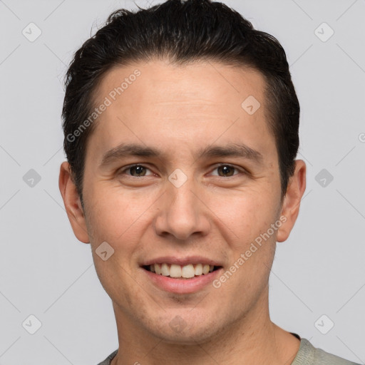 Joyful white young-adult male with short  brown hair and brown eyes