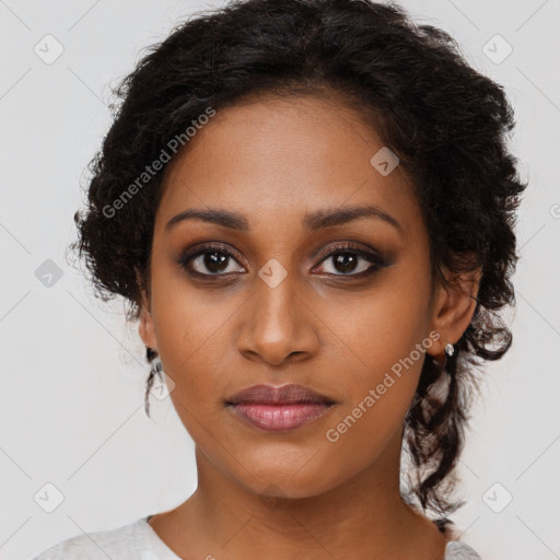 Joyful black young-adult female with medium  brown hair and brown eyes