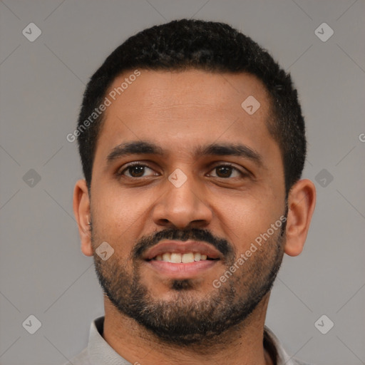 Joyful black young-adult male with short  black hair and brown eyes