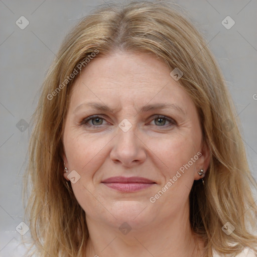 Joyful white adult female with medium  brown hair and grey eyes