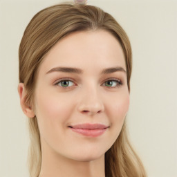 Joyful white young-adult female with long  brown hair and green eyes