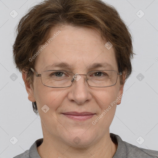 Joyful white adult female with short  brown hair and grey eyes