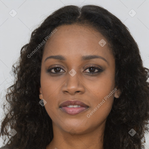 Joyful black young-adult female with long  brown hair and brown eyes