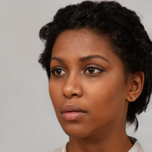 Neutral black young-adult female with short  brown hair and brown eyes