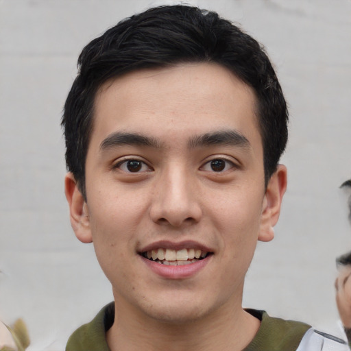 Joyful asian young-adult male with short  black hair and brown eyes