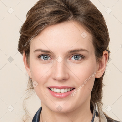 Joyful white young-adult female with long  brown hair and blue eyes