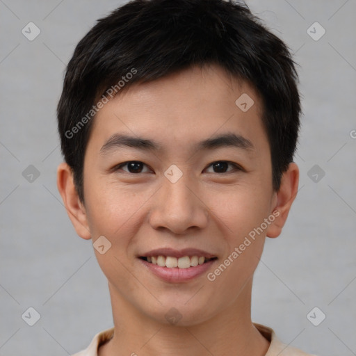 Joyful asian young-adult male with short  brown hair and brown eyes