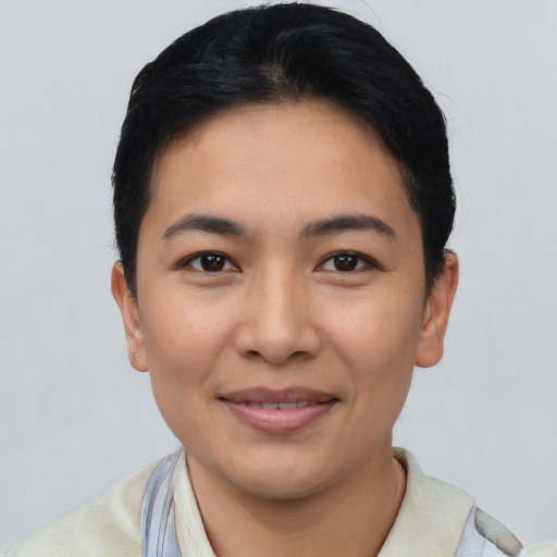 Joyful asian young-adult female with short  black hair and brown eyes