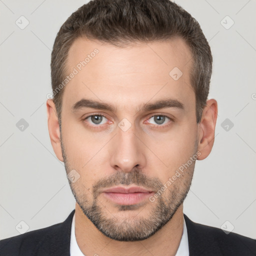 Neutral white young-adult male with short  brown hair and brown eyes