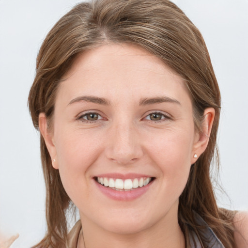 Joyful white young-adult female with long  brown hair and grey eyes