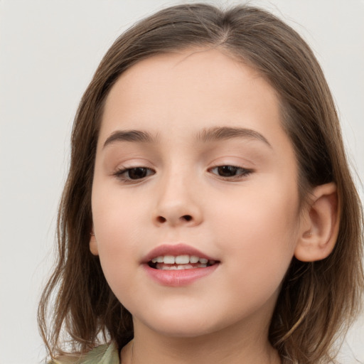 Joyful white child female with long  brown hair and brown eyes