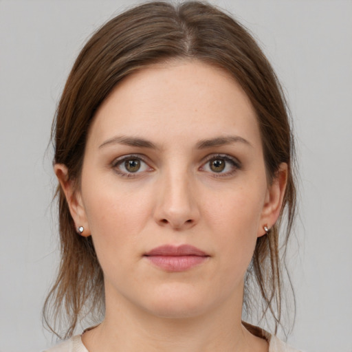 Neutral white young-adult female with medium  brown hair and brown eyes