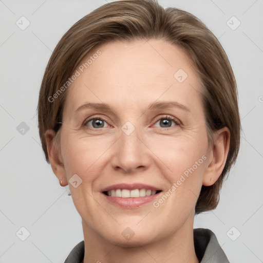 Joyful white adult female with medium  brown hair and grey eyes